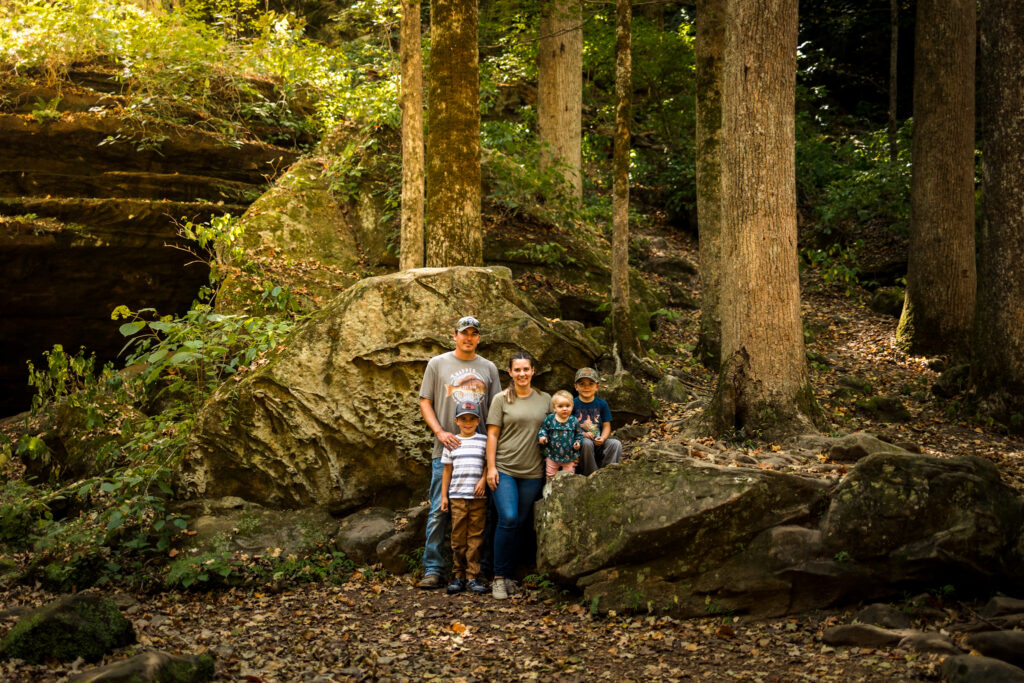 The Garriotts a family of five in a mossy fern covered forest